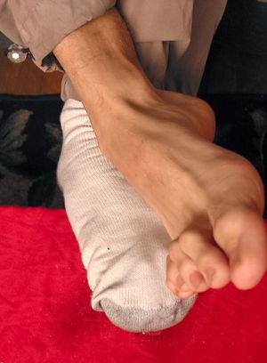 Kelly Cooper shows off his socks and sexy feet