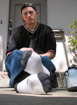 Nick shows off his socks and feet